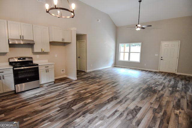 kitchen featuring stainless steel range oven, ceiling fan with notable chandelier, dark hardwood / wood-style flooring, and white cabinets