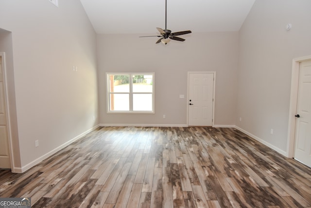 spare room with high vaulted ceiling, ceiling fan, and hardwood / wood-style flooring