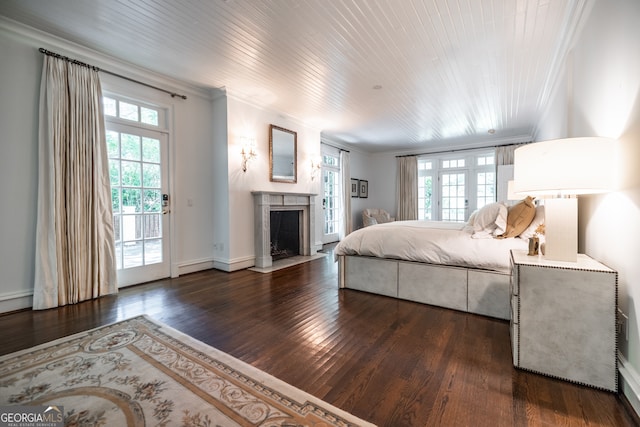 bedroom featuring dark wood-type flooring, access to exterior, and ornamental molding