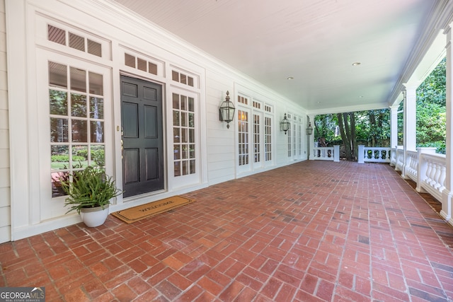 view of patio / terrace featuring french doors and a porch