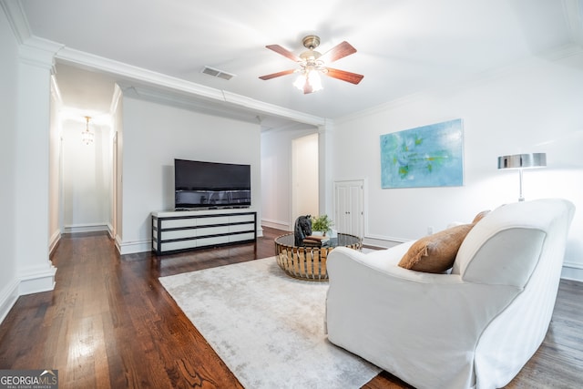 living room featuring crown molding, ceiling fan, and dark hardwood / wood-style flooring