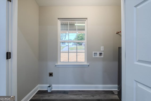 laundry area with dark wood-type flooring, hookup for a washing machine, and electric dryer hookup