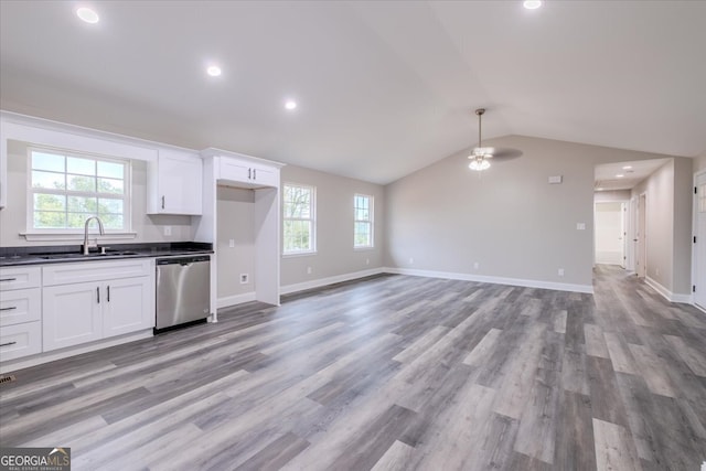 kitchen with stainless steel dishwasher, ceiling fan, sink, and light wood-type flooring