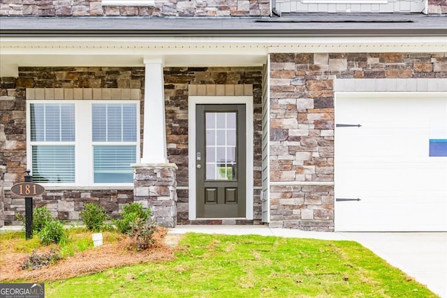 property entrance featuring a porch and a garage