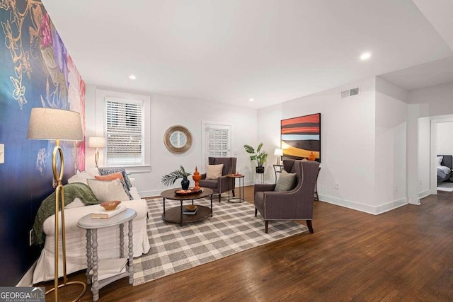 living room with dark hardwood / wood-style flooring