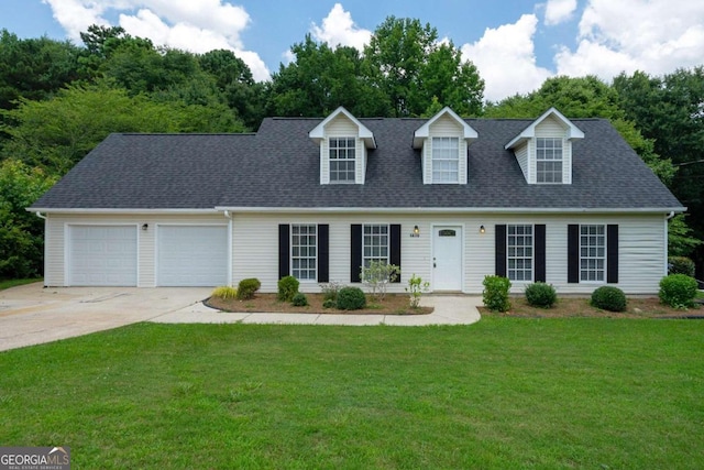 new england style home featuring a garage and a front lawn