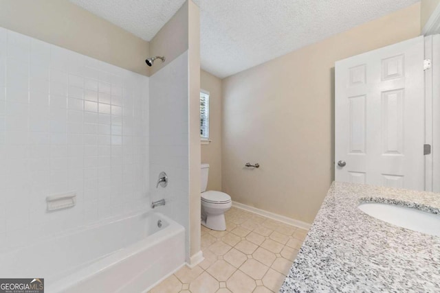 full bathroom featuring tile patterned flooring, a textured ceiling, sink, tiled shower / bath, and toilet