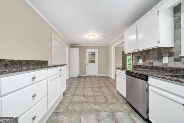 kitchen with dark stone counters, dishwasher, light tile patterned flooring, white cabinets, and backsplash