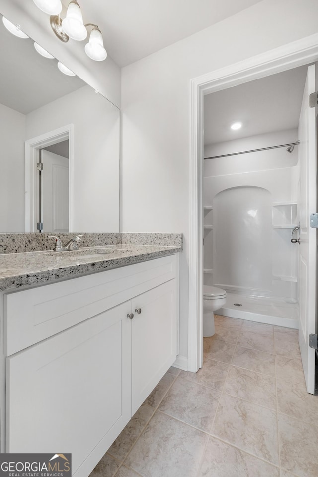 54 Charlie Fuller Rd Lot 3, Grantville, GA 30220 - full bath featuring vanity, toilet, a shower stall, and tile patterned flooring