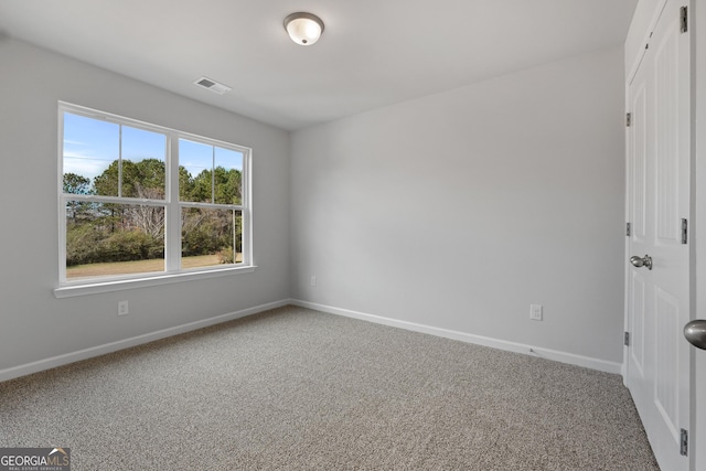 54 Charlie Fuller Rd Lot 3, Grantville, GA 30220 - carpeted spare room with visible vents and baseboards