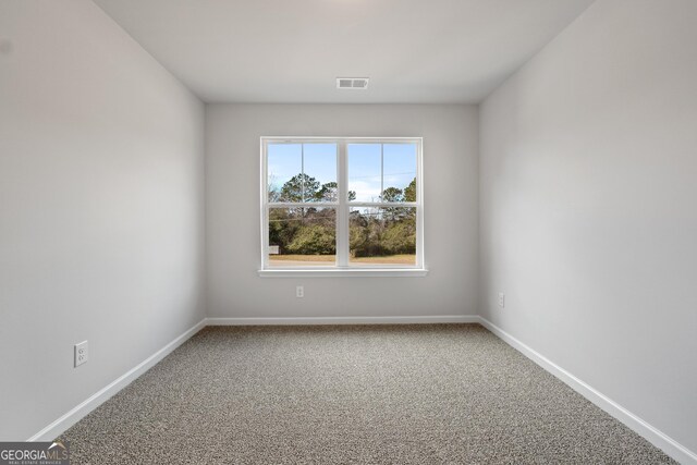 54 Charlie Fuller Rd Lot 3, Grantville, GA 30220 - spare room with baseboards, visible vents, and carpet