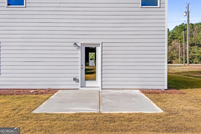 54 Charlie Fuller Rd Lot 3, Grantville, GA 30220 - doorway to property with a lawn and a patio area