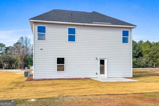 54 Charlie Fuller Rd Lot 3, Grantville, GA 30220 - rear view of house with central air condition unit, a shingled roof, and a lawn