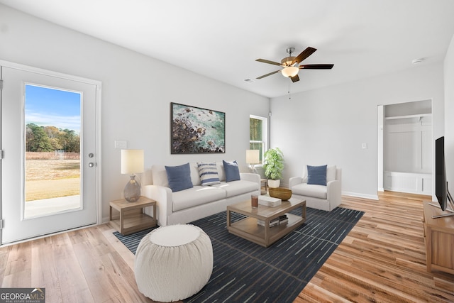 54 Charlie Fuller Rd Lot 3, Grantville, GA 30220 - living room with visible vents, light wood-style flooring, baseboards, and ceiling fan
