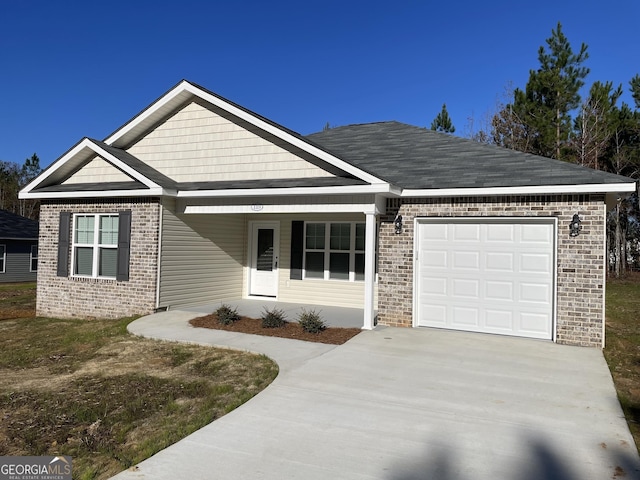 view of front of property with a garage and covered porch