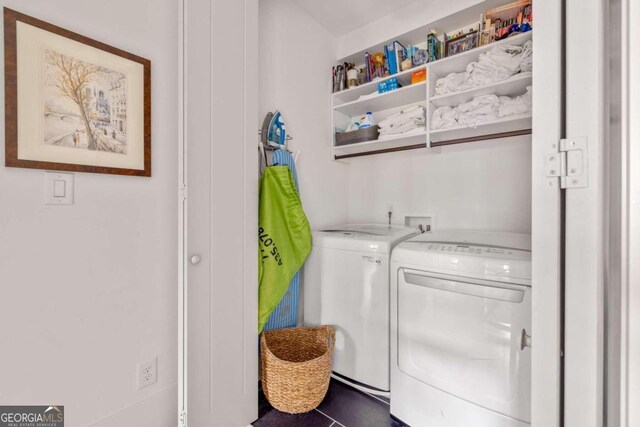 washroom featuring tile patterned flooring and separate washer and dryer