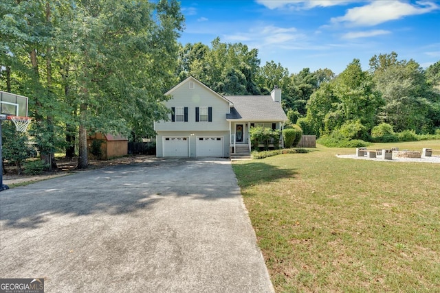 view of front of property with a garage and a front lawn