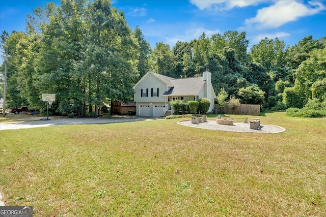 view of front of property featuring a garage and a front yard