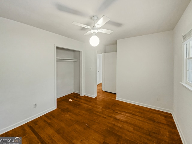 unfurnished bedroom with a closet, ceiling fan, and dark hardwood / wood-style floors