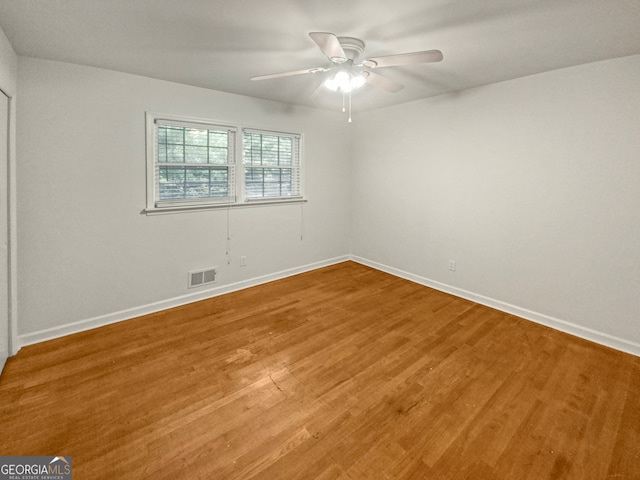 spare room featuring ceiling fan and wood-type flooring