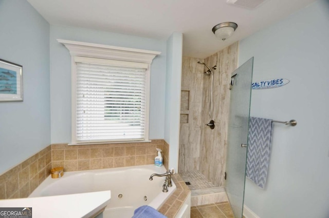 bathroom featuring vanity and plus walk in shower