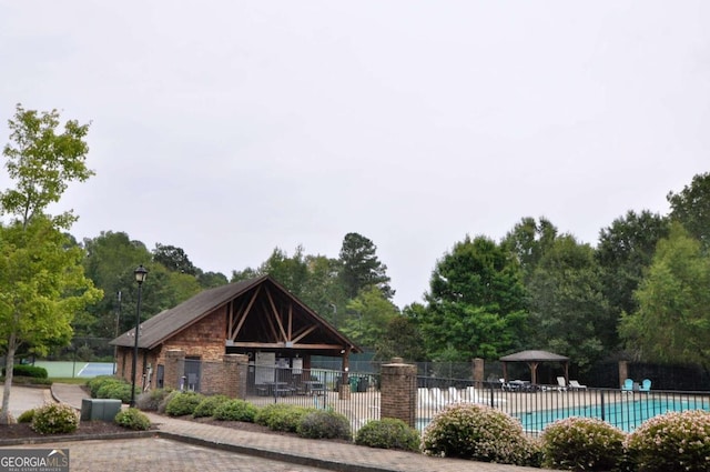 view of property's community with a gazebo and a pool