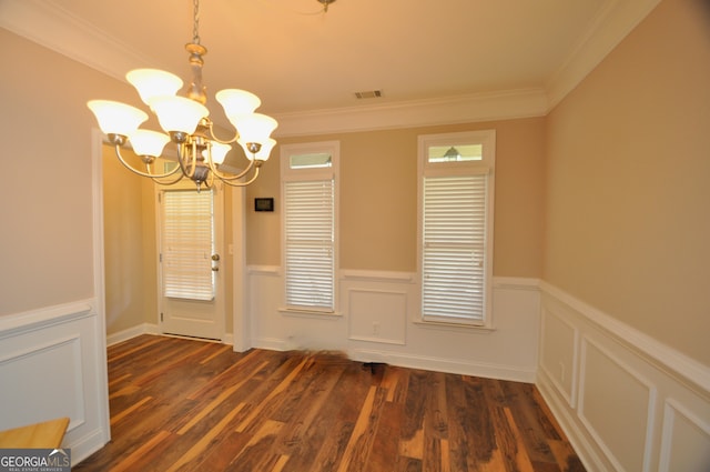 interior space featuring an inviting chandelier, ornamental molding, and dark hardwood / wood-style flooring