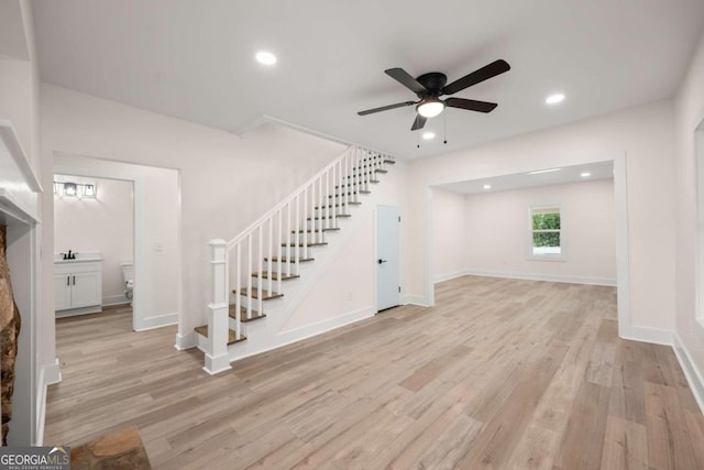 foyer entrance featuring ceiling fan and light hardwood / wood-style floors