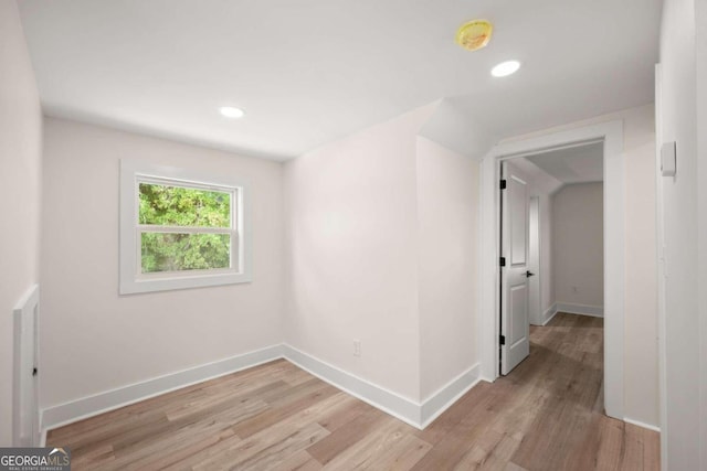 spare room with light hardwood / wood-style flooring