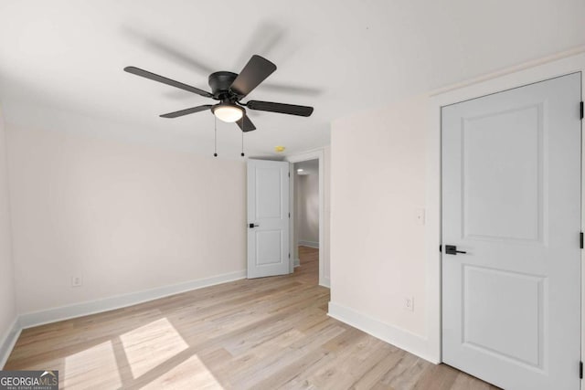 unfurnished bedroom with ceiling fan and light hardwood / wood-style flooring