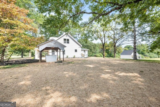 view of side of property featuring a gazebo