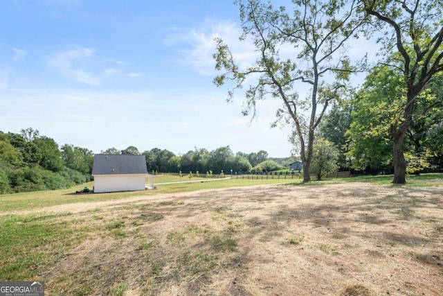 view of yard with a rural view