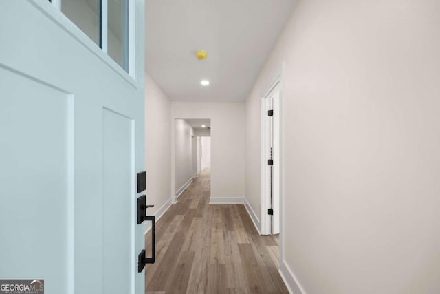 hallway with light wood-type flooring