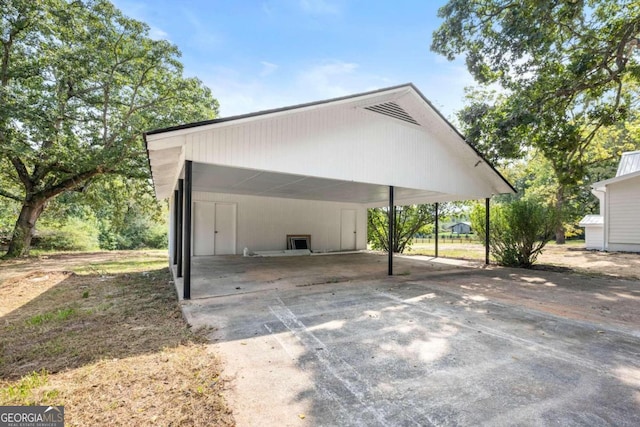 garage featuring a carport