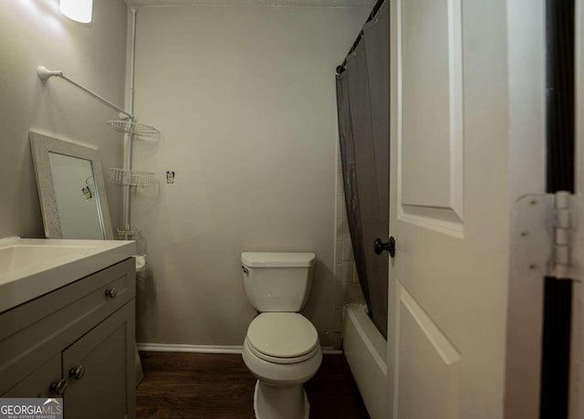 full bathroom with vanity, shower / bath combo with shower curtain, toilet, and hardwood / wood-style flooring