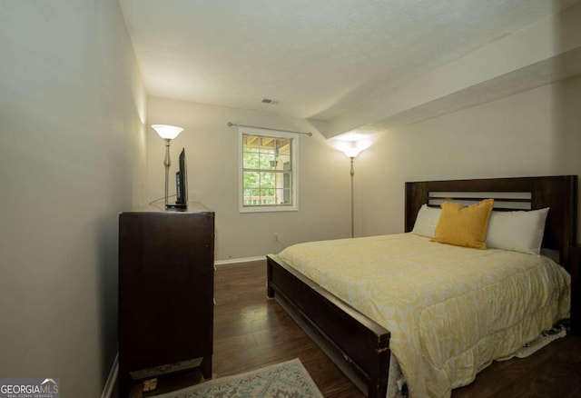 bedroom featuring dark hardwood / wood-style floors