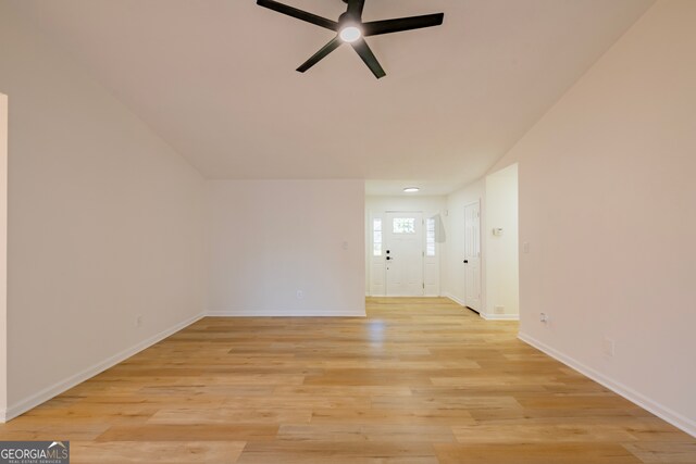 unfurnished living room with light wood-type flooring and ceiling fan