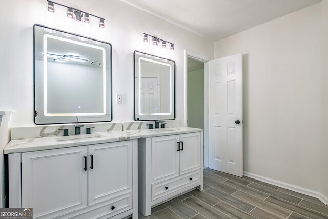 bathroom featuring vanity and wood-type flooring