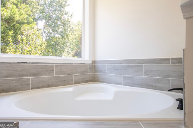 bathroom with a washtub