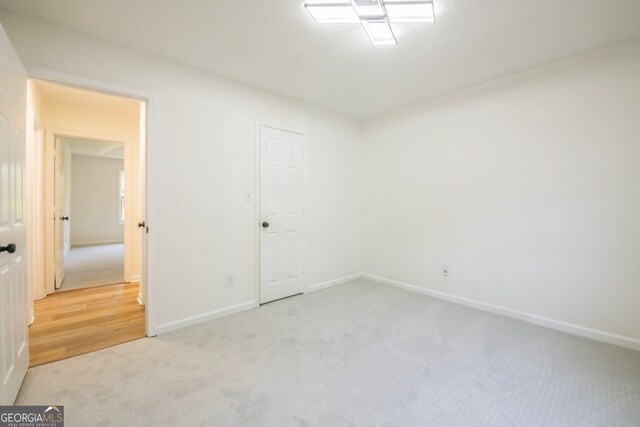 unfurnished room featuring light hardwood / wood-style floors