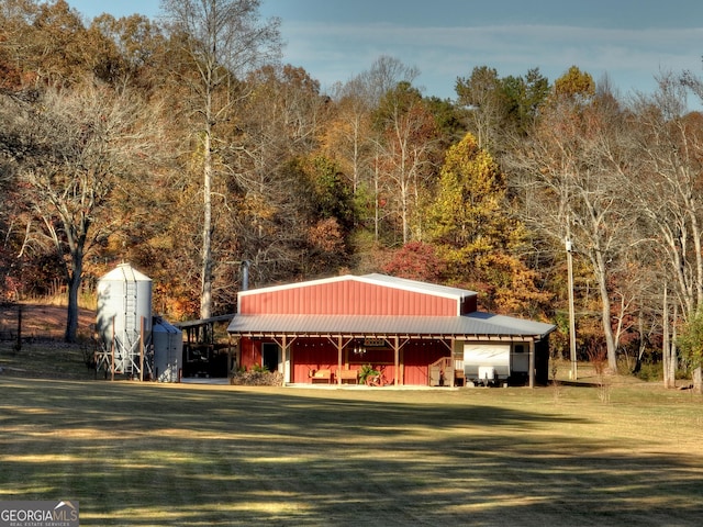 view of outdoor structure featuring a lawn