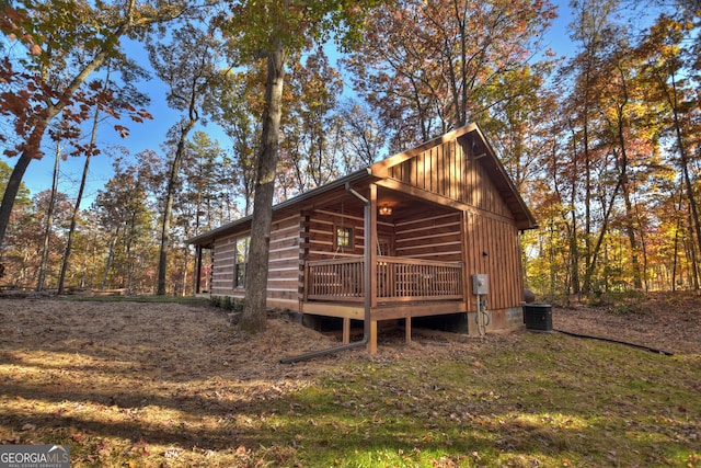 rear view of property featuring a deck and central air condition unit