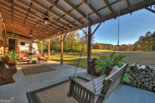 view of patio / terrace with ceiling fan and an outdoor living space