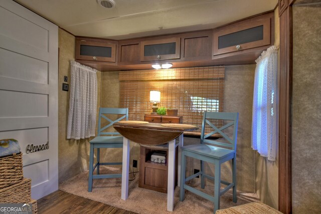 dining area featuring dark hardwood / wood-style flooring