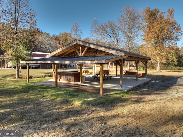 view of community with a patio and a yard