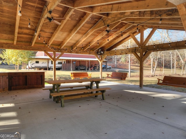 view of patio / terrace featuring ceiling fan and a gazebo