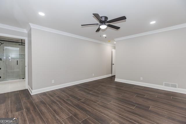 empty room featuring dark wood-type flooring, ceiling fan, and ornamental molding