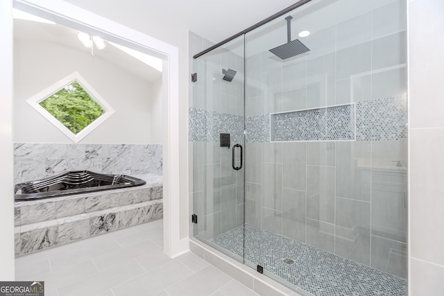 bathroom featuring separate shower and tub and tile patterned floors