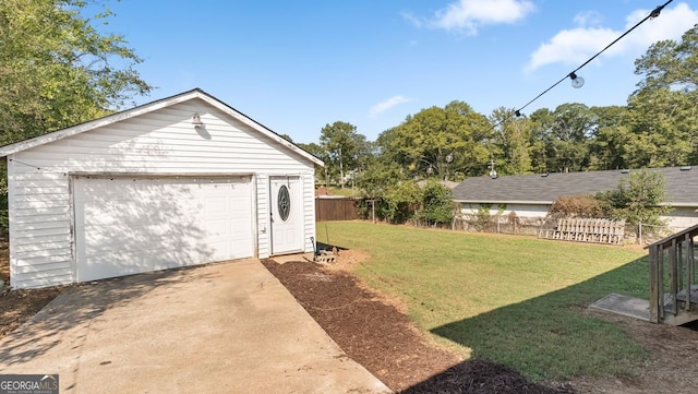 garage featuring a yard