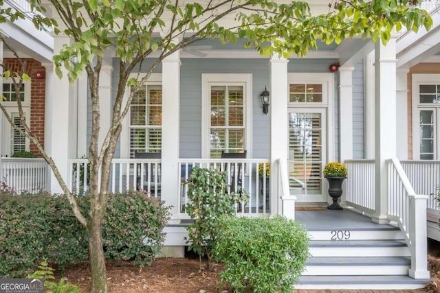 doorway to property featuring covered porch